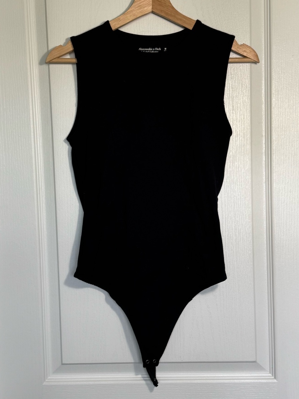 Black Sleeveless One-Piece Bodysuit